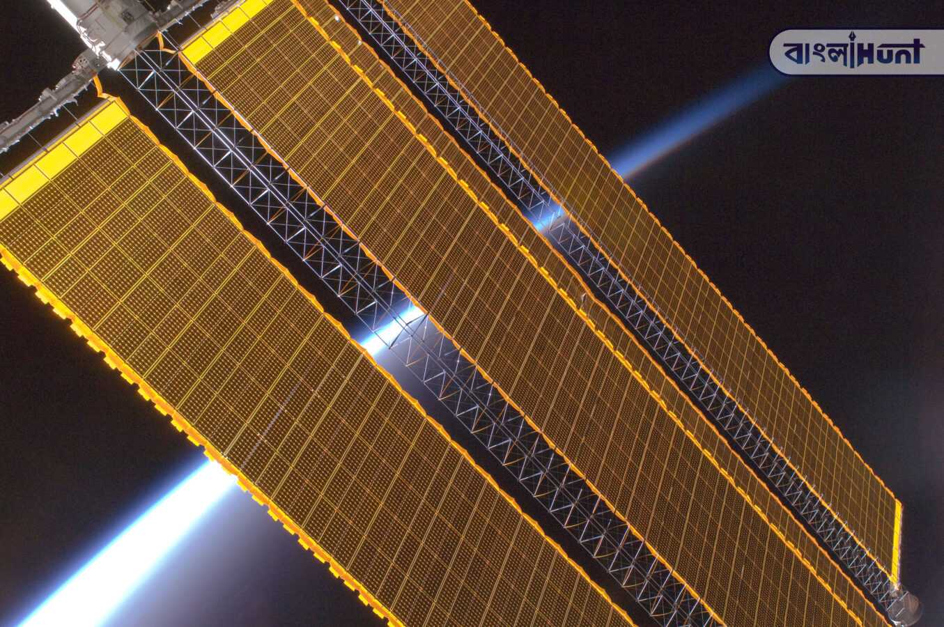 Earth horizon and International Space Station solar panel array Expedition 17 crew August 2008