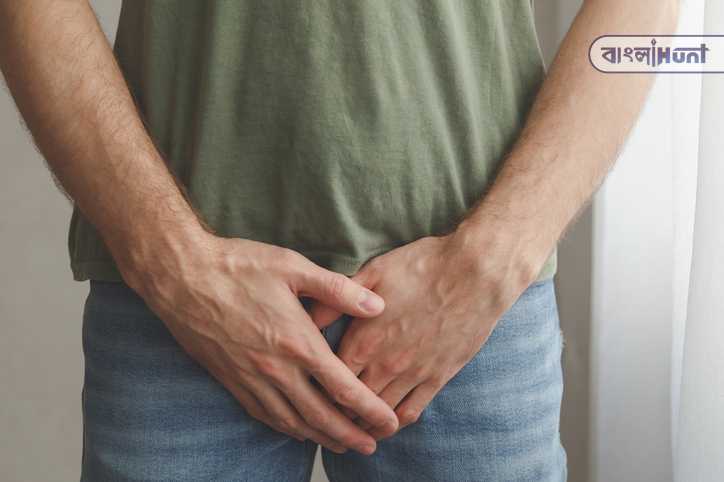 man cover his groin by hands. men's health. urology problems male