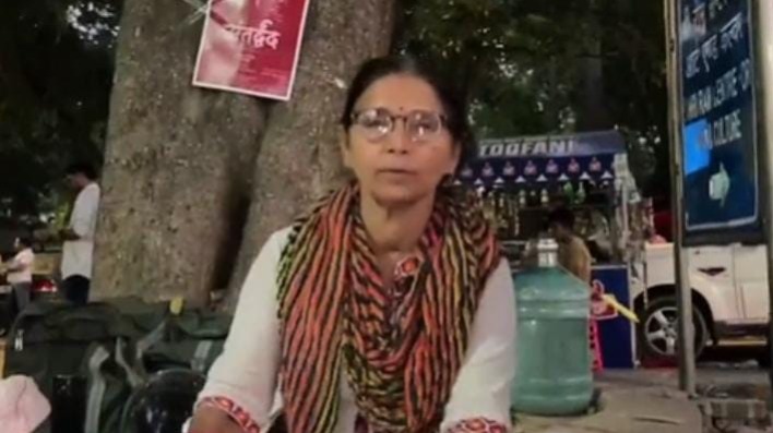 Why is this woman selling books on the footpath 