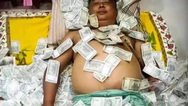 Leader lying on bed of money, viral photo.