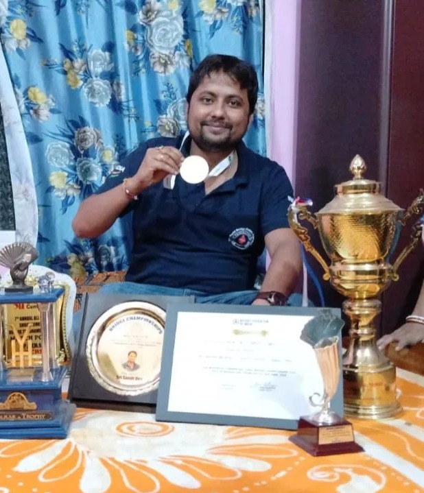 Sanjit won gold medal by playing card.