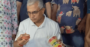 Dilip Ghosh walks with dugdugi in protest