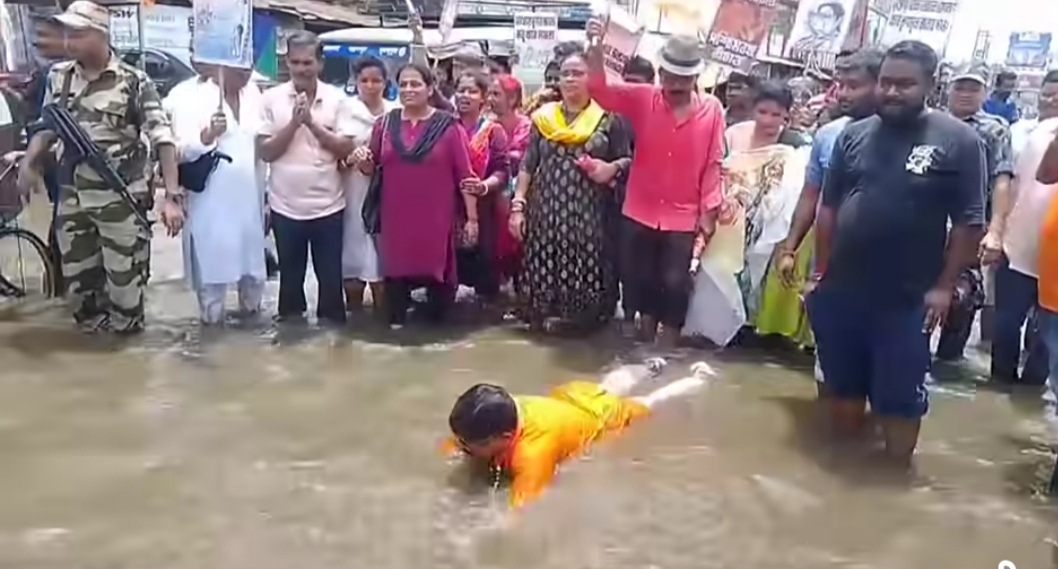 BJP mla protested in chakda while swimming in flooded road 