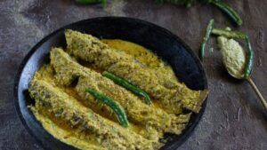 Recipe fish oil sauce dish on the side in a hotel style kitchen