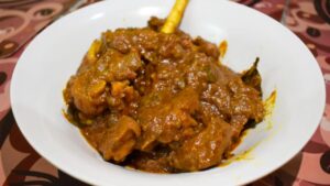 Recipe prepare traditional mutton curry using spices ground on a grinding stone