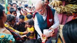 PM Narendra Modi visits a jhalmuri stall in Jhargram.