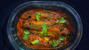 Recipe a delicious Tangra Machher Tel Jhal with just a few ingredients